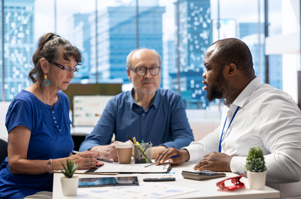 Senior couple meeting with their doctor to review Medicare Annual Enrollment Period changes