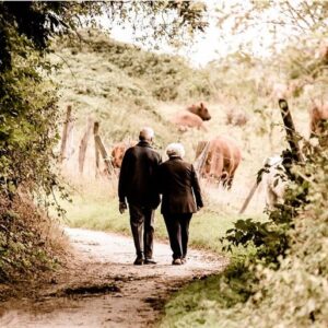 Senior couple walking outdoors for daily exercise