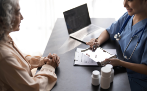 Family meeting at a desk with a doctor to discuss Medicare coverage