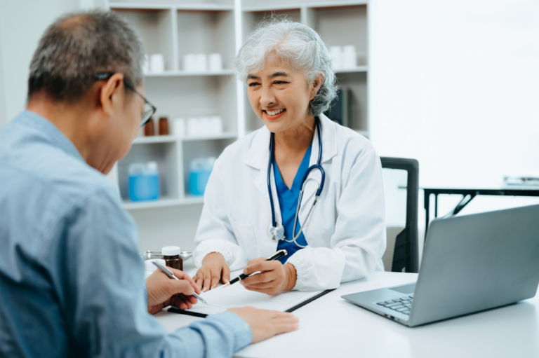 Doctor speaking with a senior patient about Medicare-covered care